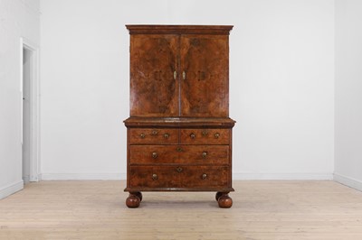 Lot 98 - A walnut cabinet on chest