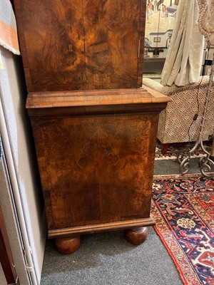 Lot 98 - A walnut cabinet on chest