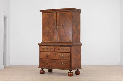 Lot 98 - A walnut cabinet on chest