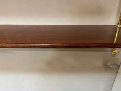 Lot 444 - A set of Regency-style mahogany and brass hanging shelves