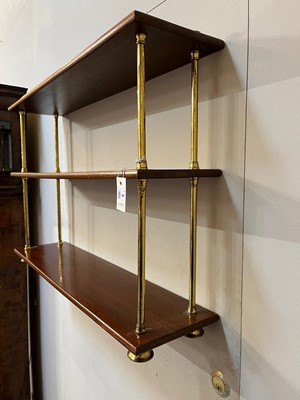 Lot 444 - A set of Regency-style mahogany and brass hanging shelves