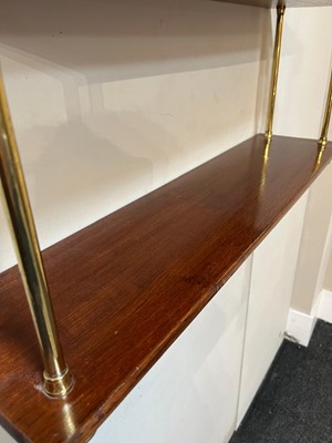 Lot 444 - A set of Regency-style mahogany and brass hanging shelves