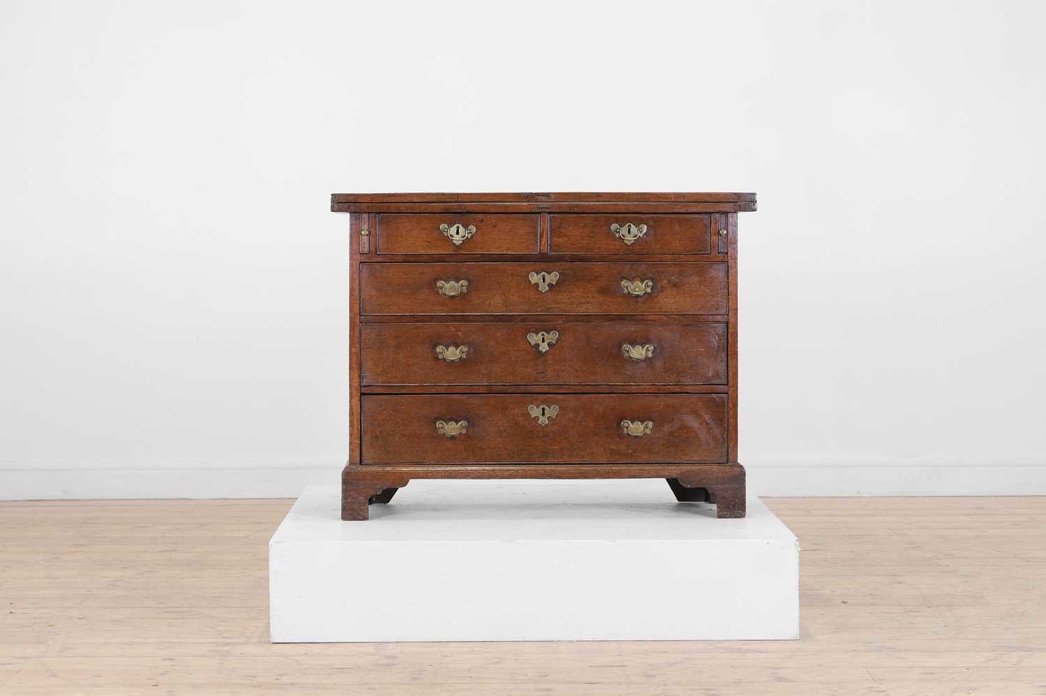 Lot 445 - A small George II oak bachelor's chest