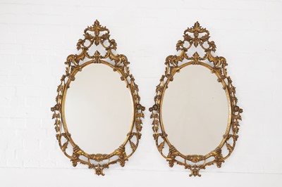 Lot 649 - A pair of George III-style giltwood mirrors