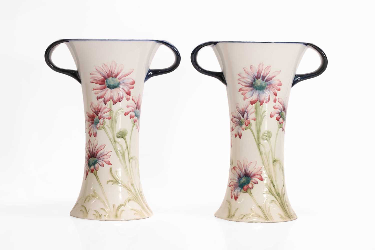 Lot 130 - A pair of William Moorcroft 'Daisy' vases