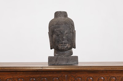 Lot 191 - A carved grey stone Buddha head