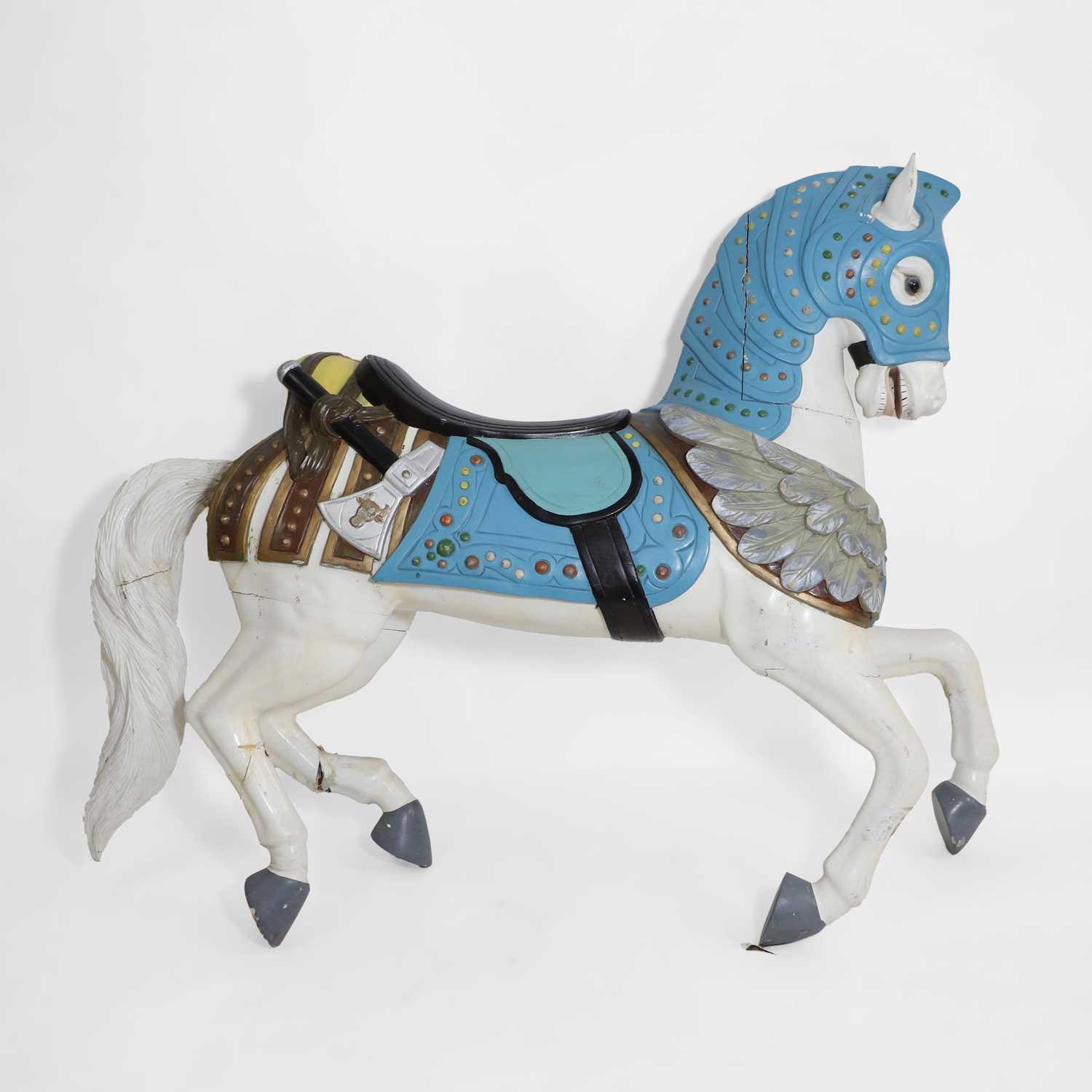 Lot 182 - A carved and painted hardwood fairground horse in the manner of Charles Loof
