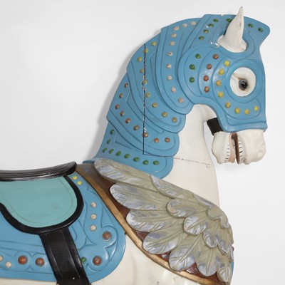 Lot 182 - A carved and painted hardwood fairground horse in the manner of Charles Loof