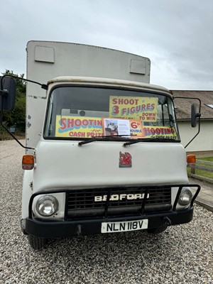 Lot 163 - A 1980 Bedford rigid body lorry, containing a showman's hoopla, shooting gallery and a coconut shy
