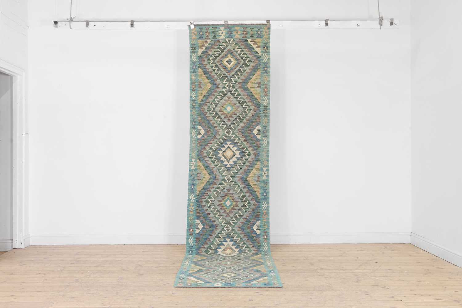 Lot 570 - A flat-weave wool kilim runner