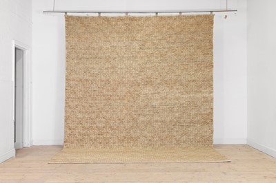 Lot 574 - A contemporary natural jute carpet