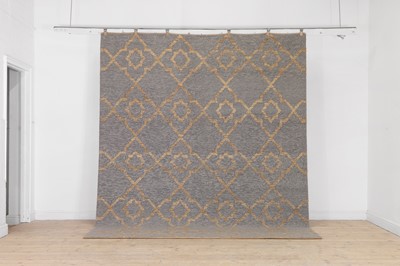 Lot 559 - A jute and wool carpet