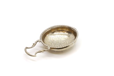 Lot 100 - An early George III silver lemon strainer