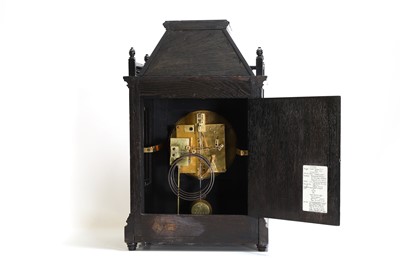 Lot 66 - An ebonised mantel clock