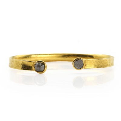 Lot 171 - A rough diamond and gold bangle