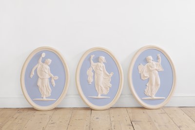 Lot 264 - A set of three painted plaster roundels in the Adam style