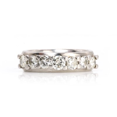 Lot 145 - A platinum and diamond half eternity ring