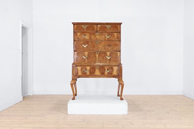 Lot 410 - A George I oyster-veneered walnut chest on stand