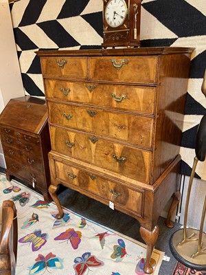 Lot 410 - A George I oyster-veneered walnut chest on stand