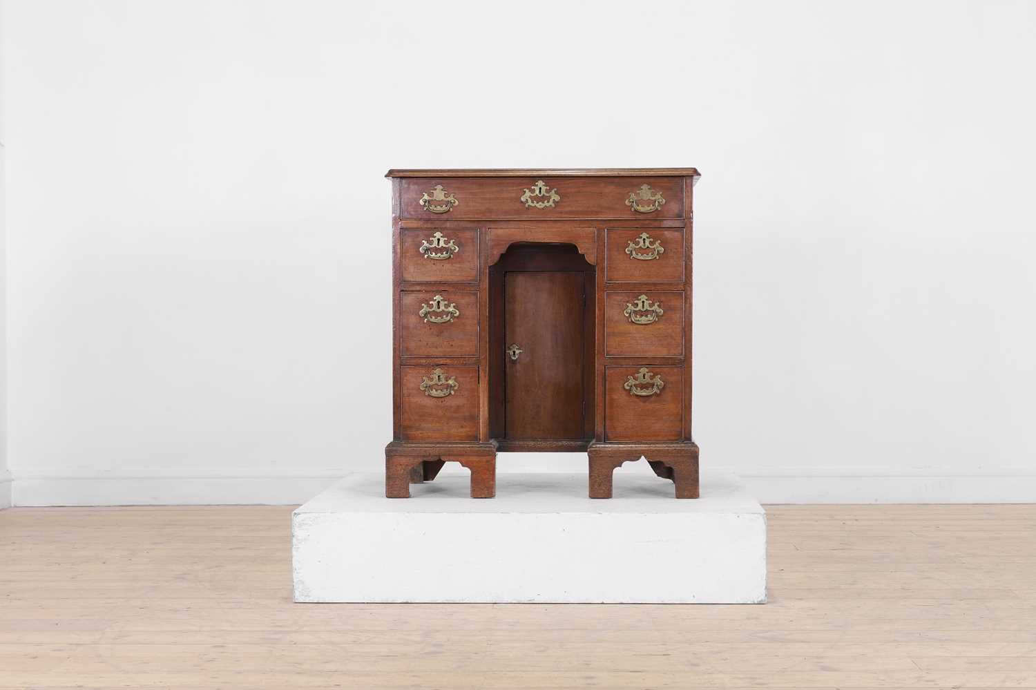 Lot 371 - A George III mahogany kneehole desk