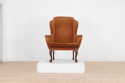 Lot 365 - A George II-style mahogany wing-back armchair