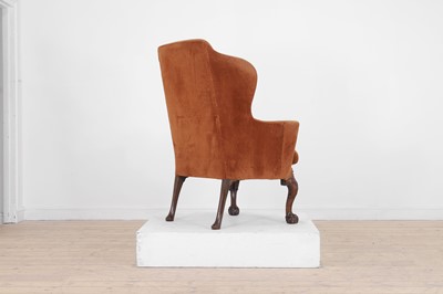 Lot 365 - A George II-style mahogany wing-back armchair