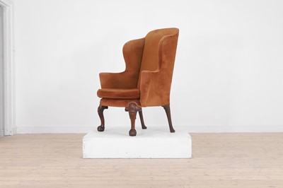 Lot 365 - A George II-style mahogany wing-back armchair