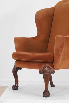 Lot 365 - A George II-style mahogany wing-back armchair