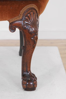 Lot 365 - A George II-style mahogany wing-back armchair