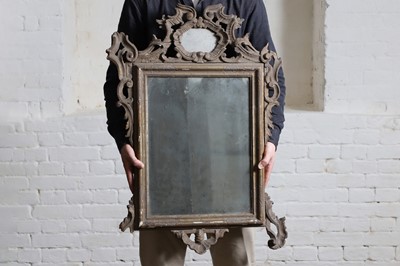 Lot 42 - A carved giltwood wall mirror