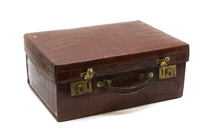 Lot 396 - A crocodile leather skin suitcase