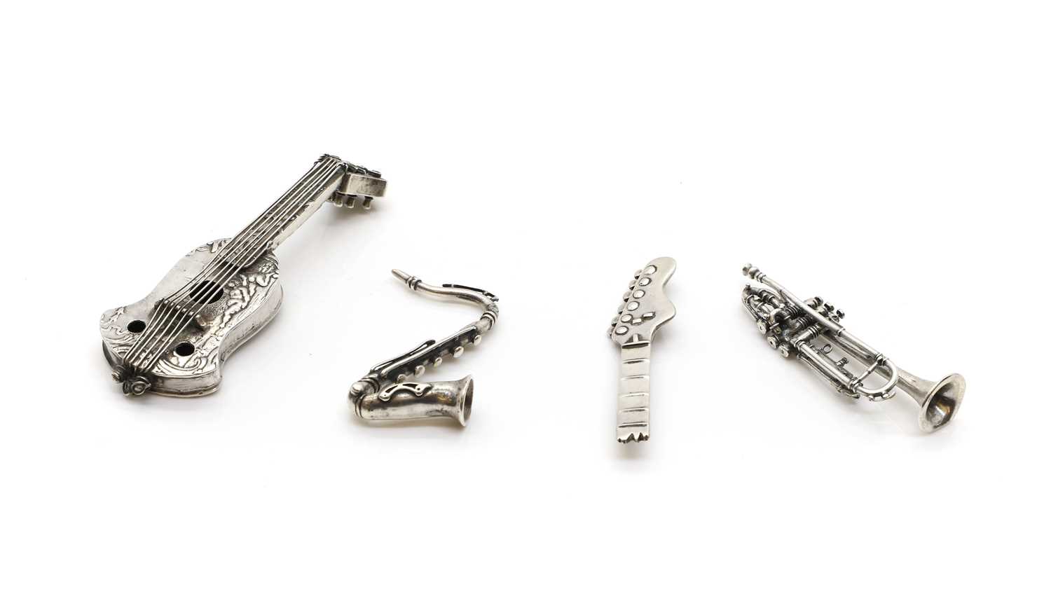 Lot 67 - A group of four silver novelty musical instruments