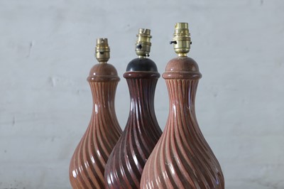 Lot 350 - A pair of Holkham Pottery simulated porphyry table lamps