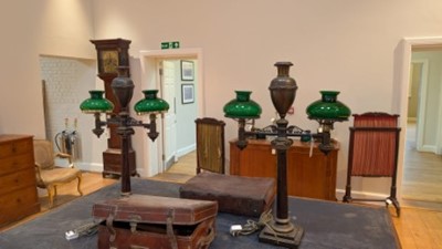 Lot 47 - A pair of bronze twin-branch library lamps