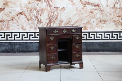 Lot 81 - A George III mahogany kneehole desk