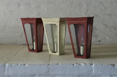 Lot 327 - A set of three toleware wall lanterns