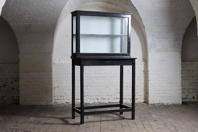 Lot 393 - A black-painted display cabinet