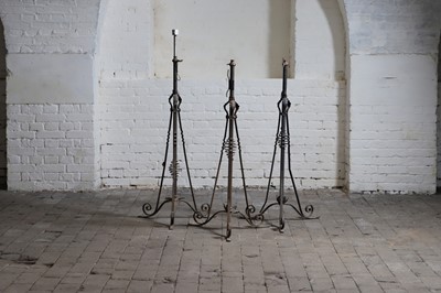 Lot 374 - A group of three brass and iron standard lamps