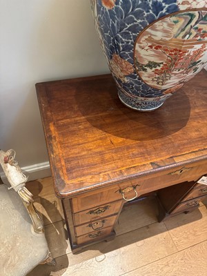 Lot 74 - A George I walnut kneehole desk or dressing table