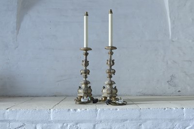 Lot 60 - A pair of carved and gilt table lamps