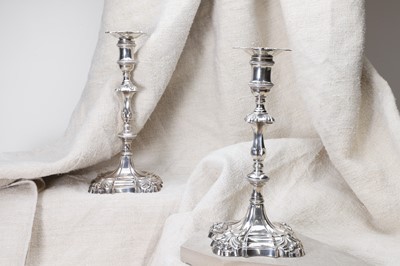 Lot 30 - A pair of George II cast silver candlesticks