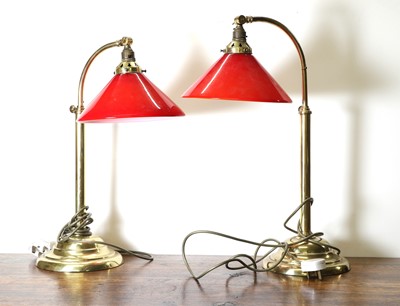 Lot 147 - A pair of arched brass reading lamps