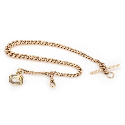 Lot 518 - A 9ct rose gold Albert chain with a citrine fob