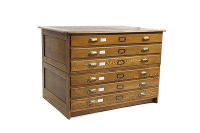 Lot 569 - An oak plan chest