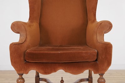 Lot 428 - A William and Mary-style walnut wing-back armchair