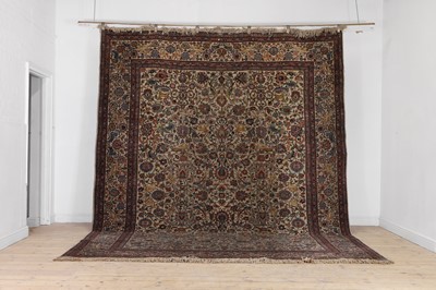 Lot 398 - A large Persian cream ground carpet