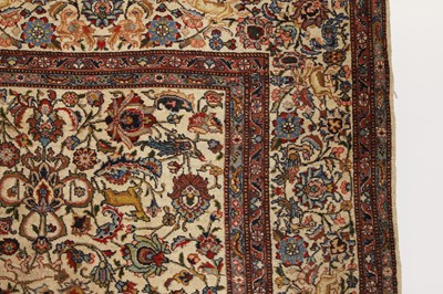 Lot 398 - A large Persian cream ground carpet