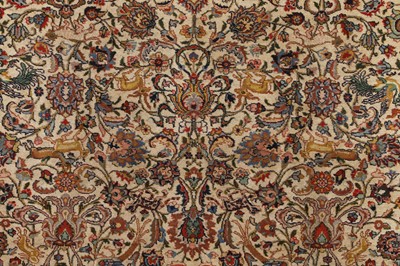 Lot 398 - A large Persian cream ground carpet