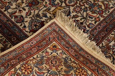 Lot 398 - A large Persian cream ground carpet