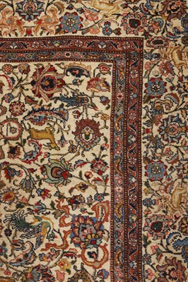 Lot 398 - A large Persian cream ground carpet